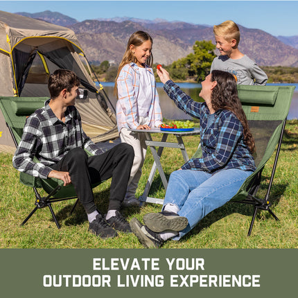 Green rocker camping chairs with black frame around a family camping by a lake